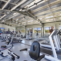Stay active in the state-of-the-art gym at Poipu Beach Athletic Club, equipped with modern fitness machines.