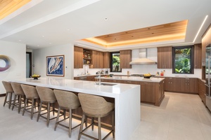 Gather around the expansive kitchen island where culinary dreams come alive in your stylish retreat.