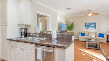 The beautiful kitchen has bar seating and an open floor plan for entertaining.