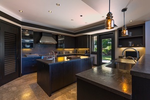 Prepare gourmet meals with ease in a chef-ready kitchen featuring premium appliances and generous counter space.