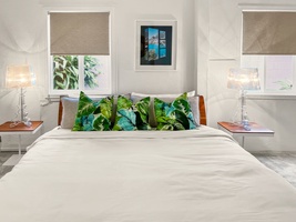 Spacious primary suite with a king bed and charming decor.