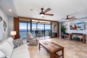 Seamless indoor-outdoor living with wall to wall windows to the lanai provide the perfect backdrop.