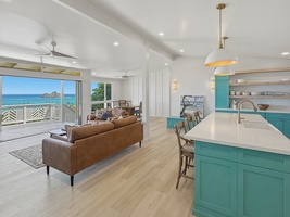 Wake up to stunning ocean views from your spacious living area, where modern comfort meets coastal charm in every thoughtful detail.