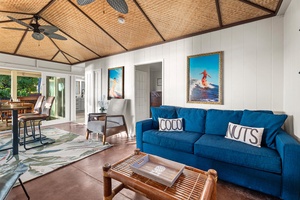 Breezy living room with woven ceilings and island-inspired décor, opening seamlessly to the outdoors.