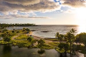 Wake up to breathtaking sunset views over the fishponds and white sand beaches of the Kohala Coast.
