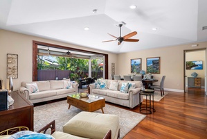 The bright and airy living area has high ceilings and central AC.