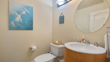 Conveniently located on the main level, this half bath adds ease and accessibility for guests during gatherings and meals.