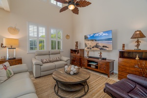 Plush seating at the living area with a large flatscreen TV.