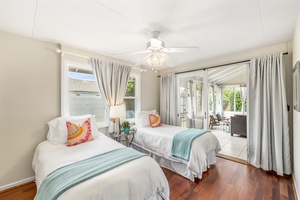 With lovely natural lighting and sliders to the lanai, the guest bedroom is a relaxing space.