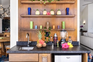 Tropical-themed wet bar adds playful energy to your gathering space, perfect for evening mocktails or mai tais.