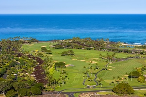 Spectacular oceanfront golf course with championship greens, palm trees, and pristine fairways stretching to the azure Pacific horizon.