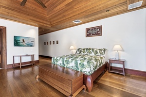 Drift off to sleep surrounded by rich tropical wood and authentic island art, where comfort meets the natural beauty of your island retreat.