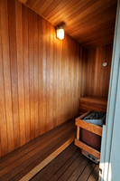 Five-person cedar sauna for post-swim recovery and quiet moments of warmth.