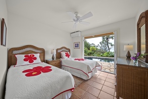 Wake up to tropical paradise in your twin bedroom with stunning pool views and charming hibiscus-themed bedding.
