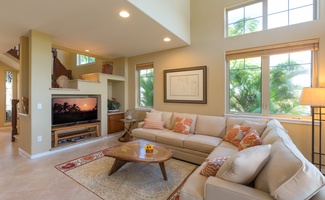 Comfortable living room with soaring ceilings, plush seating, and a welcoming atmosphere.