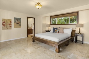 Relax in the second primary bedroom featuring a king bed.