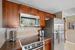 The sleek Bosch appliances and mosaic backsplash at Honua Kai Konea 204 add modern charm to this chef-ready kitchen.