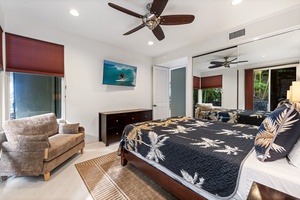 Unwind in your spacious bedroom featuring a plush Queen bed, cozy seating area, and tropical decor that creates the perfect island retreat.