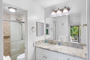 Wailea Ekolu 1605 boasts a bright, modern bathroom with a spacious vanity, perfect for all your essentials.