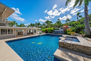 Lush backyard with large pool deck and pool give you all the feels of having your own private mini hotel!  (Note: Upper pool area is apart of the pool and NOT a spa)