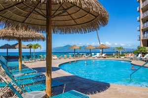 Relax poolside at Royal Kahana 610 with the resort rising just behind.