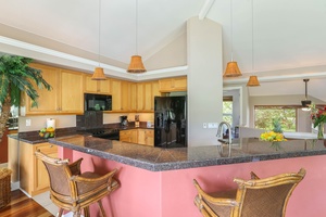 The kitchen bar offers a casual spot for morning coffee or evening drinks.