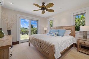 The downstairs guest bedroom four features a king-sized bed and lanai.