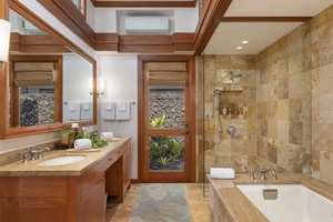 The ensuite bathroom feature a soaker tub and shower, providing a spa-like experience for all guests.