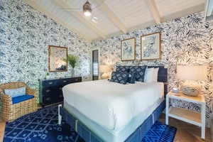 A spacious bedroom at Wailea Ekolu 1106 blends island flair with comfort and ample storage.