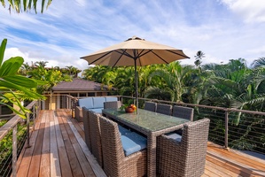 Unwind on your private deck surrounded by swaying palms, where tropical breezes and shaded dining await your perfect island escape.