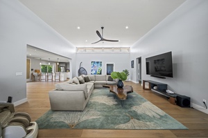 Open living area featuring a smart TV and an oversized sectional sofa for ultimate relaxation.