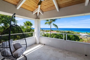 Sip your morning coffee or enjoy a book from this serene lanai corner off the bedroom.