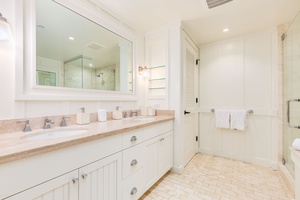A spa-like ensuite with dual vanities, deep soaking tub, and walk-in shower for ultimate relaxation.