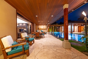 Covered deck lounge beside the pool.