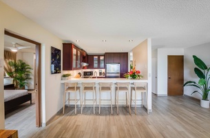 Entertain with ease at the kitchen bar featuring ample seating, perfect for casual breakfasts or evening cocktails.