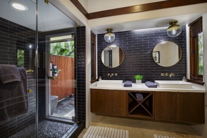 Indulge in your sophisticated bathroom retreat with dual vanities, rainfall shower, and elegant design details that create the perfect spa-like experience.