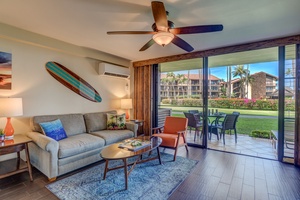 Relax in Papakea B-105’s stylish living area with easy access to lush outdoor surroundings.