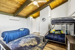 Upstairs loft featuring extra sleeping space between the 2 Twin beds and 1 Double bed