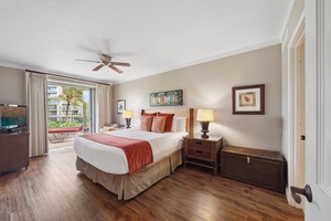 The calming bedroom at Honua Kai Konea 204 offers a king bed and lush views for deep island rest.
