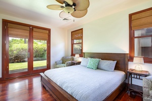Guest bedroom 4, featuring large windows, soft lighting, and outdoor garden views.