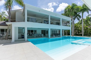 Take a refreshing dip in the sparkling pool and enjoy the spacious outdoor living area.