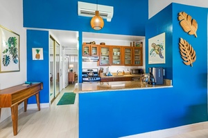 From the living room, Napili Shores F-252 offers a clear view into the spacious, modern kitchen