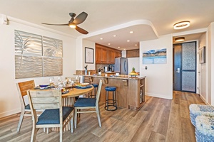 Mahana 1118 offers an open kitchen and dining layout with modern coastal style.