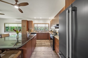 Bar seating at the kitchen island adds a casual spot for morning bites or evening conversation.