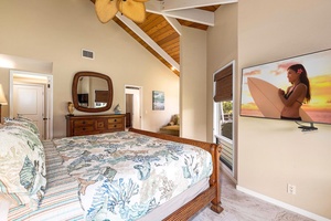 Wake refreshed beneath exposed wood ceilings, ready for another day on the Kona Coast.