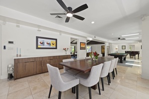 Spacious dining area for ten, where guests can gather with views of the pool and gardens.