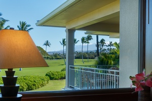 Wake up to spectacular golf course views from your private balcony, where tropical palms sway and peaceful greens stretch toward distant mountains.