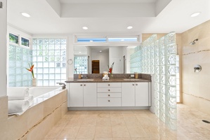 Spacious master bath with double vanity and natural light for a relaxed morning routine.