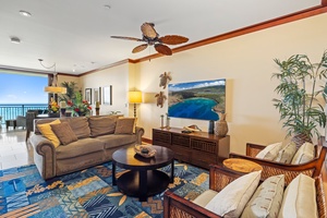 Sink into plush seating while ocean breezes flow through your tropical living space, complete with vibrant artwork and island-inspired décor.