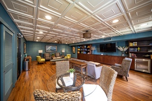 Elegant indoor lounge with plush seating, offering a cozy space to relax and socialize.